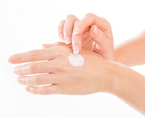 Applying CBD Cream to painful hand