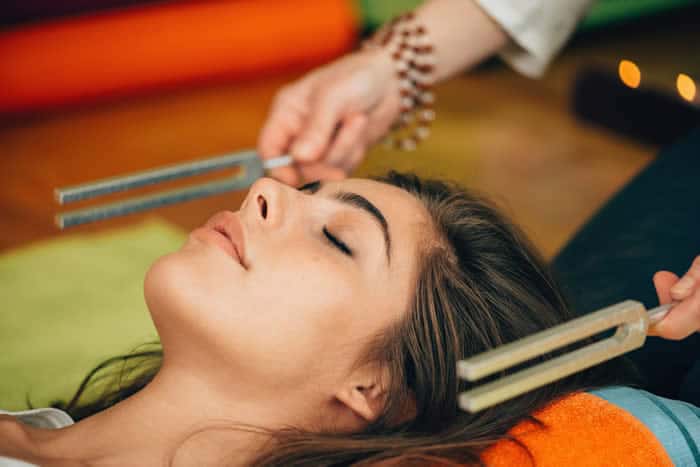 Sound baths can include the use of tuning forks.