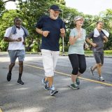 group of four healthy seniors exercising