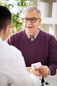 medical doctor consulting patient about supplement